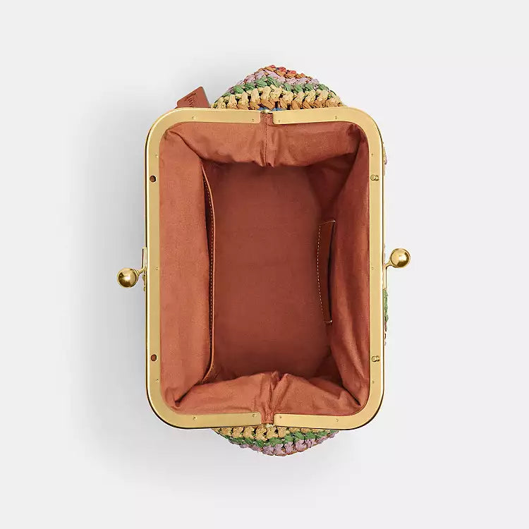 Multicolor straw Coach Large Kisslock shoulder bag with gold hardware and spacious interior, by The Tiny Bag.