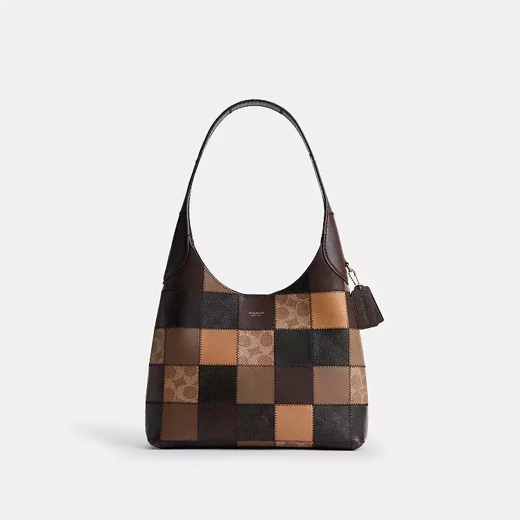 The Tiny Bag COACH Coachtopia Alter/Ego Brooklyn shoulder bag in tan and brown with signature multi-colored details.