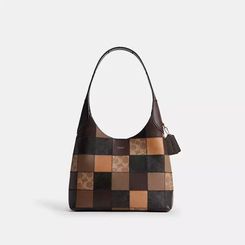 The Tiny Bag COACH Coachtopia Alter/Ego Brooklyn shoulder bag in tan and brown with signature multi-colored details.