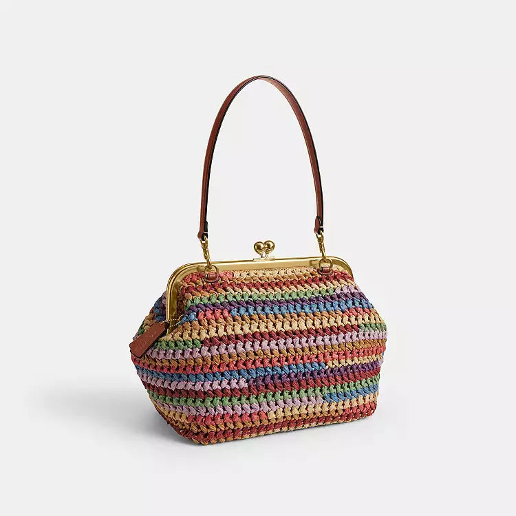 Multicolor straw Coach Kisslock shoulder bag with large size and gold-tone clasp, stylish accessory by The Tiny Bag.