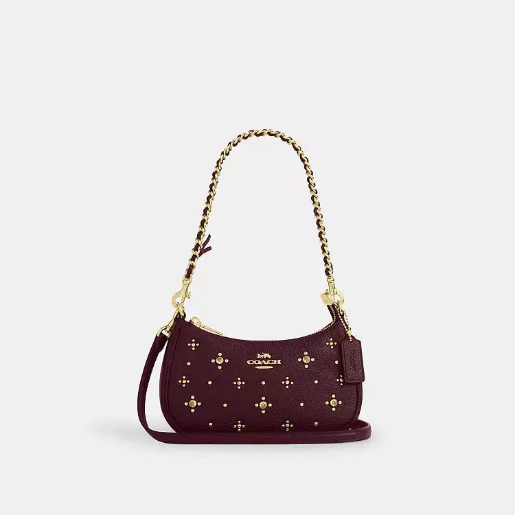 Dark wine leather Coach CCE43 Teri Mini Crossbody Bag with crystal accents, featuring a compact shoulder bag design.