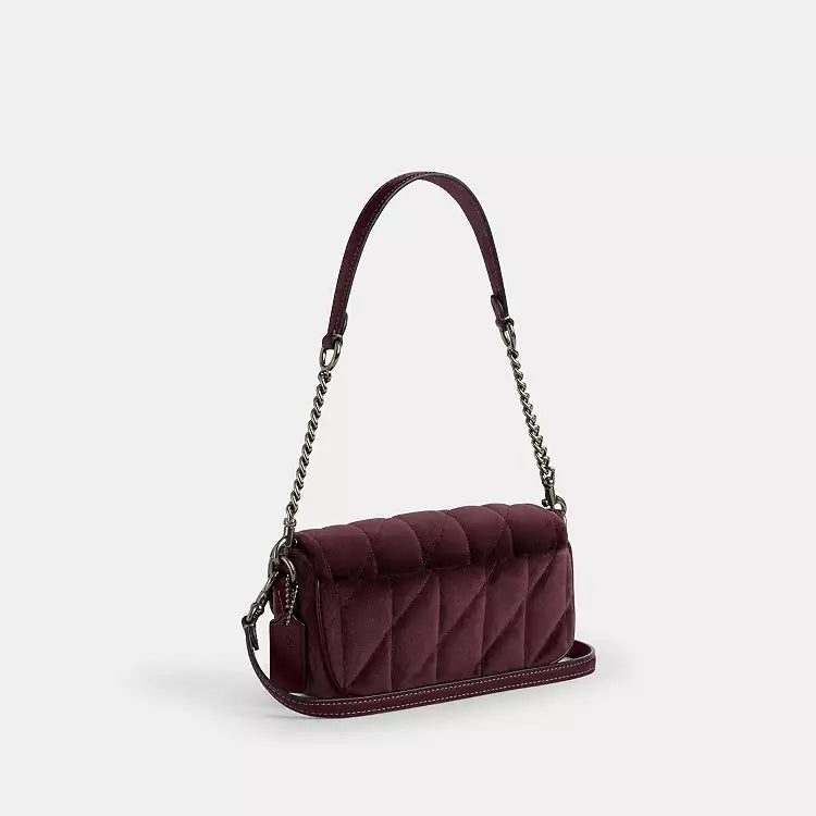 The Tiny Bag Coach CCE13 Hailey Flap Bag in burgundy velvet organic cotton with quilting, featuring a shoulder strap and flap closure.