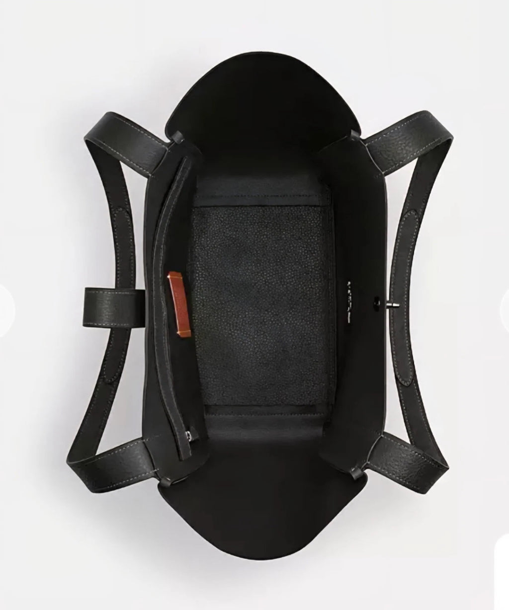 Coach Hadley tote bag in army green suede leather with turnlock detail, featuring a spacious handbag design by The Tiny Bag.