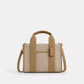 Light khaki Coach Signature Jacquard Smith Tote Bag by The Tiny Bag, showcasing the tote's fabric, handles, and stylish design.