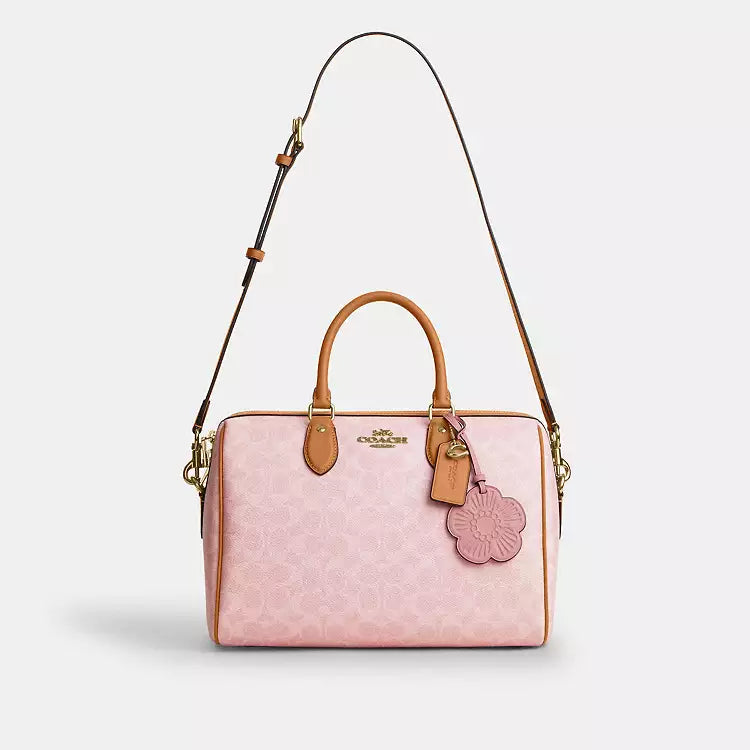 Coach Rowan large shoulder satchel bag in signature canvas with charms, in powder pink, from The Tiny Bag.