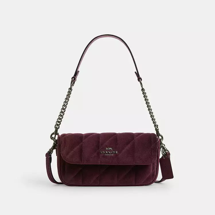 Coach Hailey Flap Bag shoulder bag in burgundy velvet with quilting, organic cotton details, and a stylish flap design.
