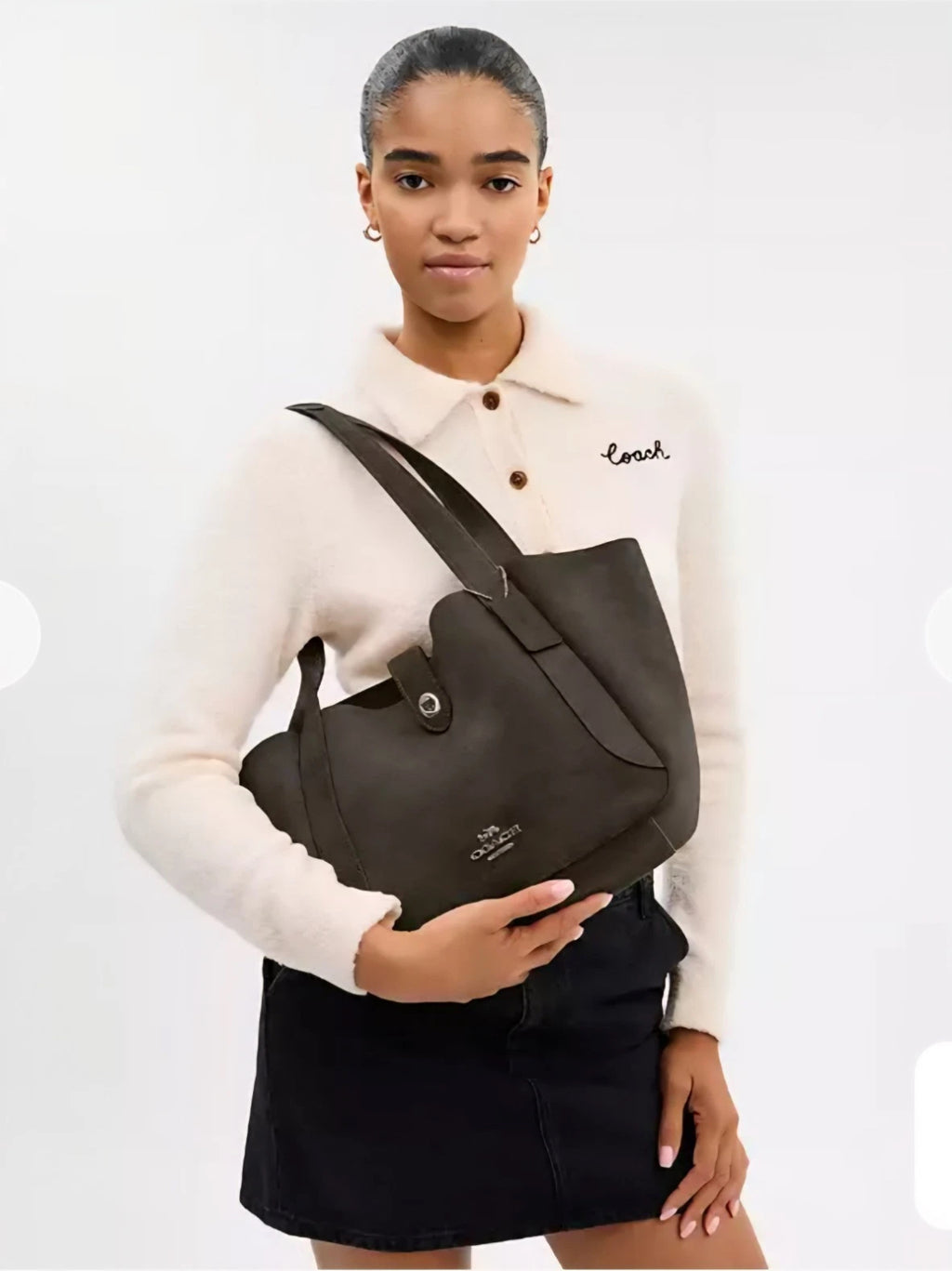 Coach Hadley Turnlock Tote Bag in army green suede leather with CCC76 branding, featuring a sleek handle and turnlock closure.