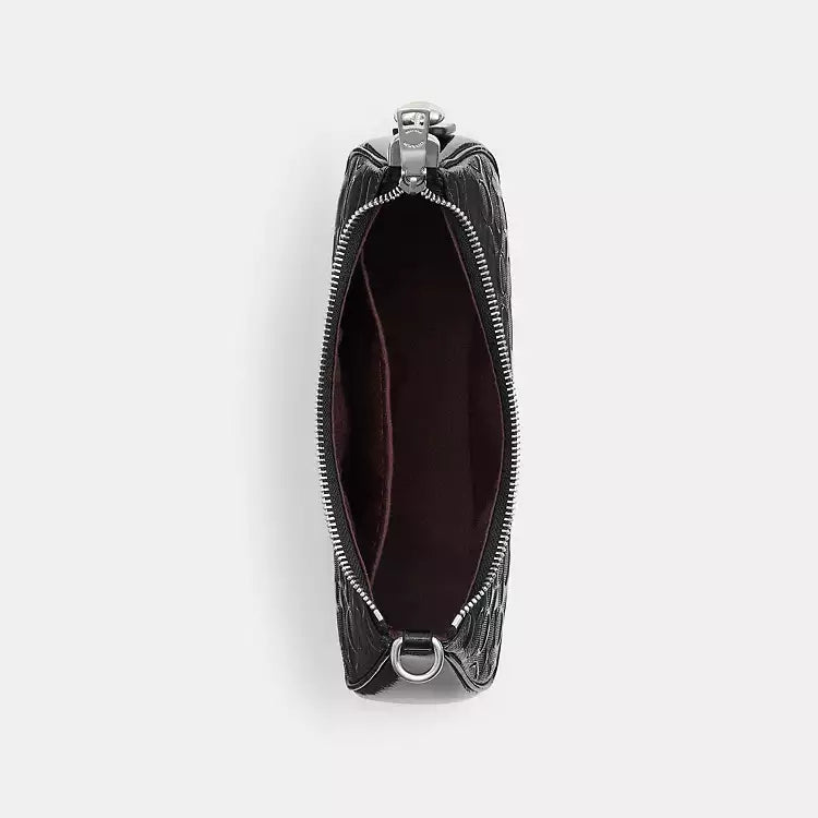 Coach Teri Shoulder Bag in signature leather with heart charm, stylish and compact for everyday use.