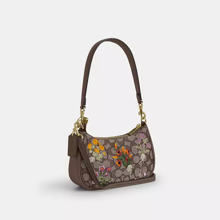 Coach Teri mini crossbody bag with signature jacquard floral embroidery, shoulder bag style, featuring a compact design and intricate detailing.
