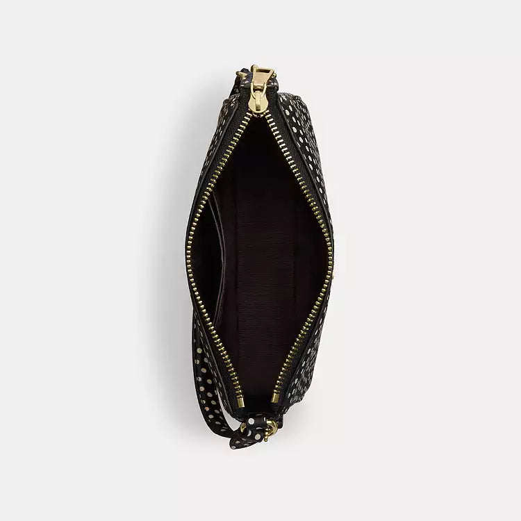 Black Coach Nolita 19 shoulder bag with spot print in refined pebble leather, featuring a compact, stylish design.
