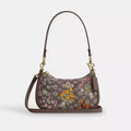 Coach Teri mini shoulder bag with signature jacquard floral embroidery, compact design, and leather accents.