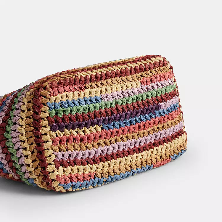 Multicolor straw Coach Kisslock large shoulder bag with gold-tone hardware and spacious interior, stylish and eye-catching design.
