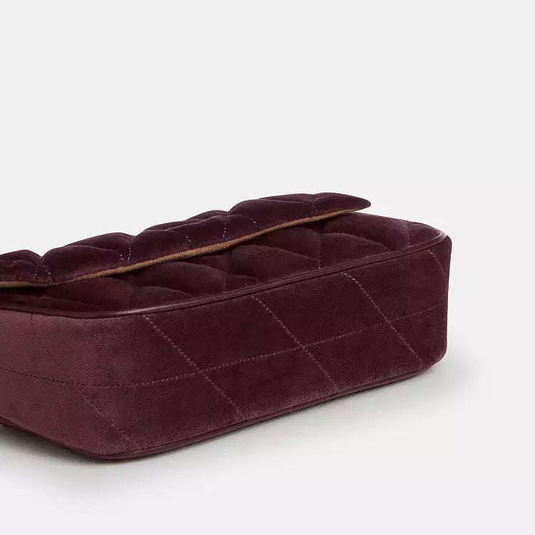 Coach Hailey Flap Bag shoulder bag in burgundy velvet with quilting and organic cotton, featuring a stylish flap design.