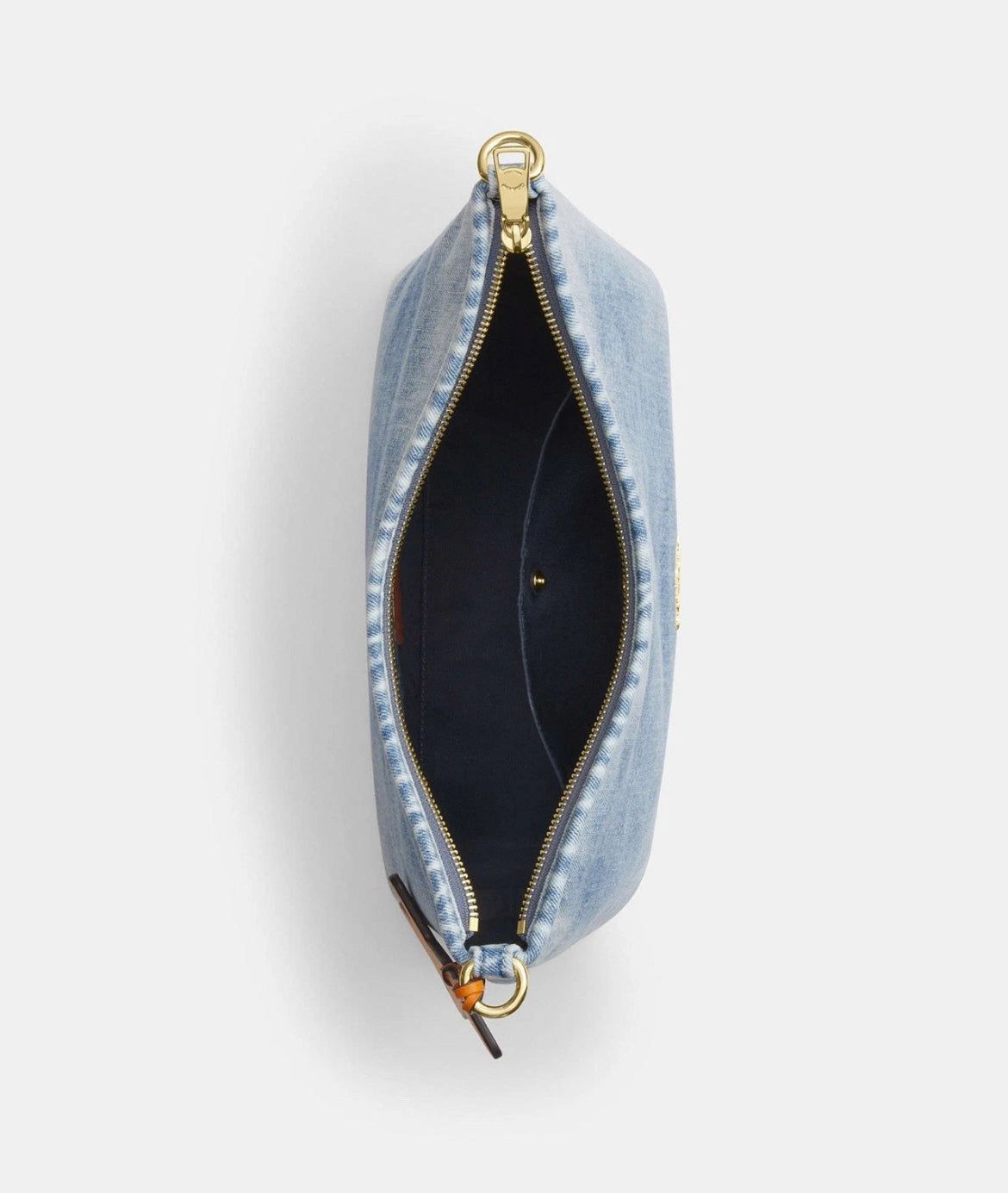 The Tiny Bag Coach CEF26 Laurel shoulder bag in light indigo denim with charms, featuring a compact design and shoulder strap.