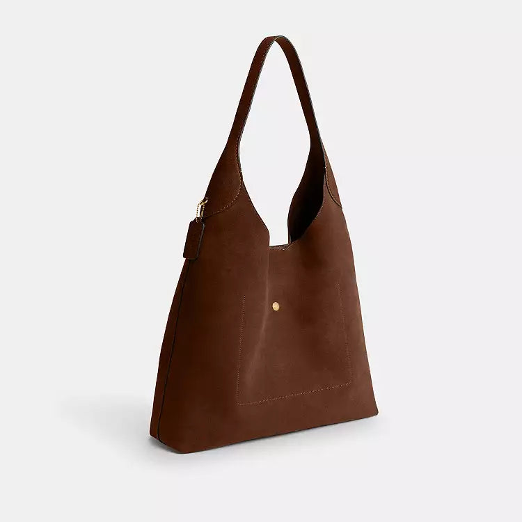 Coach CW636 suede Brooklyn 39 shoulder bag in warm brown with brass hardware, stylish and compact for everyday use.