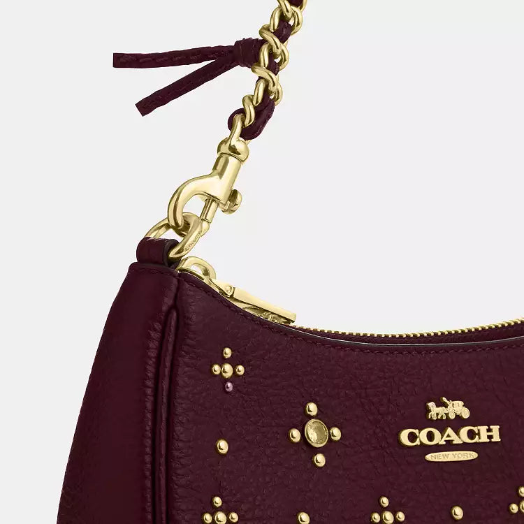 Dark wine leather Coach CCE43 Teri mini crossbody shoulder bag with crystal embellishments, compact and stylish.