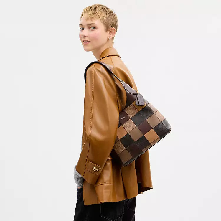 Coach Coachtopia Alter/Ego Brooklyn shoulder bag in tan and brown leather with signature multi-color detailing, stylish and versatile.