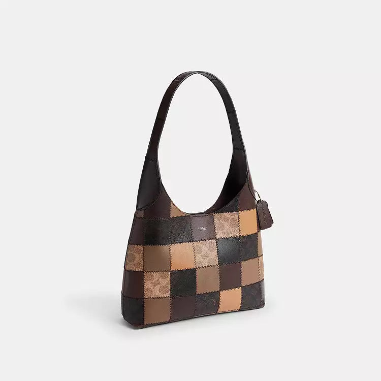 The Tiny Bag Coach Coachtopia Alter/Ego Brooklyn Shoulder Bag in tan and brown with signature multicolor accents and adjustable strap.