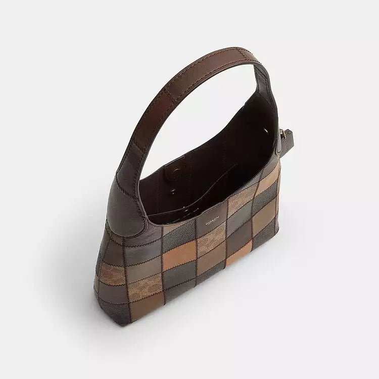 Tan and brown Coach Coachtopia Alter/Ego Brooklyn shoulder bag with signature print and adjustable strap, crafted by The Tiny Bag.