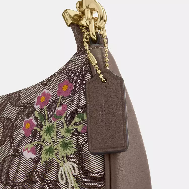 Coach Teri mini shoulder bag with signature jacquard floral embroidery, compact design, and leather accents.