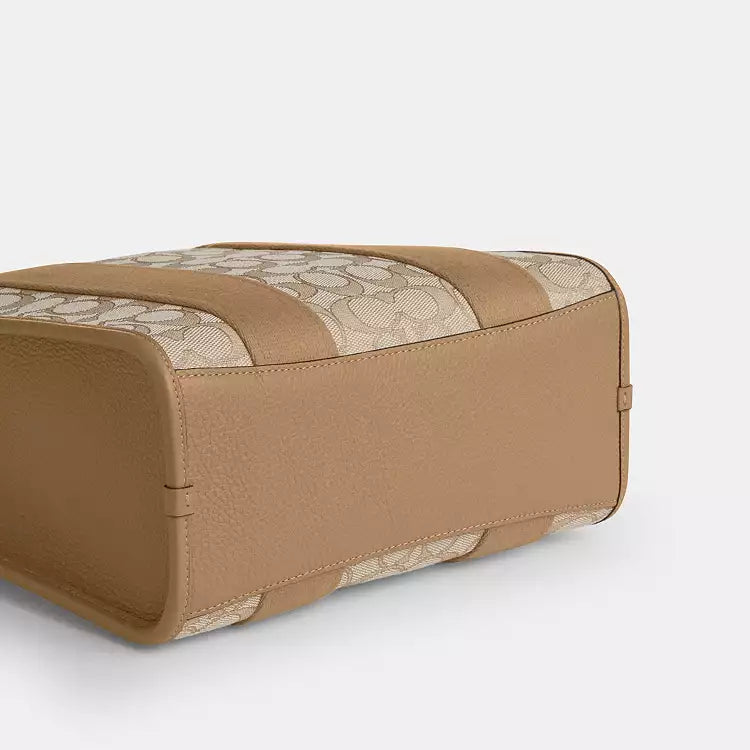 Light khaki Coach Signature Jacquard Smith Tote bag by The Tiny Bag, featuring woven fabric and structured design.