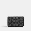 Coach Essential Slim Card Case in black Crystal Signature Jacquard wallet with multiple card slots and sleek design.