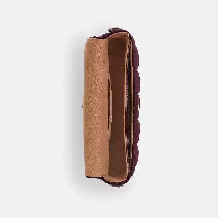 The Tiny Bag Coach CCE13 Hailey Flap Shoulder Bag in burgundy velvet with organic cotton quilting, featuring a flap design.