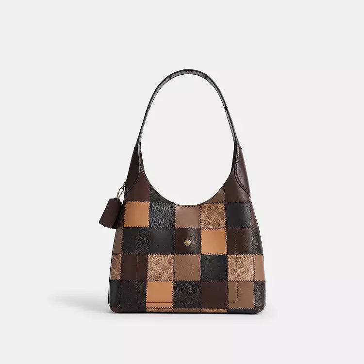 The Tiny Bag Coach Coachtopia Alter/Ego Brooklyn shoulder bag in tan and brown with signature multicolor design, compact and stylish.