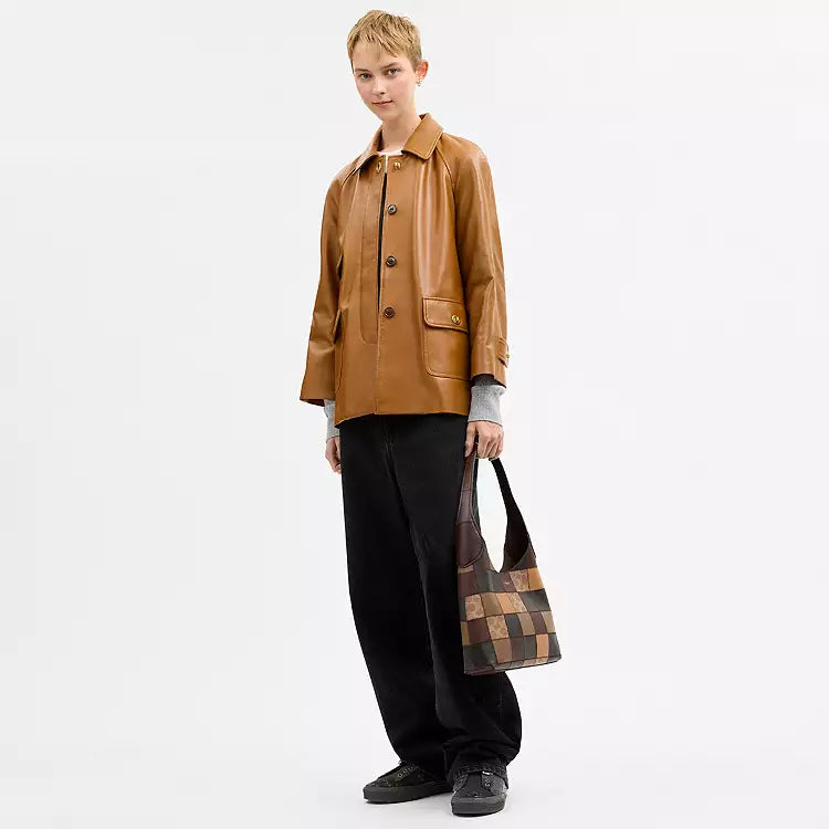Tan and brown Coach Coachtopia Alter/Ego Brooklyn shoulder bag with signature multi-brown accents, compact and stylish for everyday use.