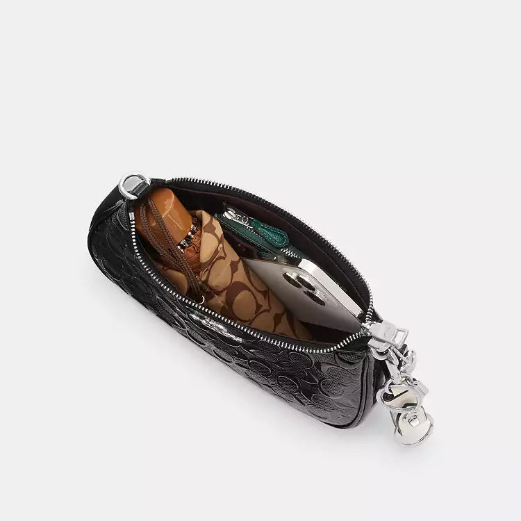 Coach Teri shoulder bag in signature leather with heart charm, featuring a sleek design and classic brand detailing.