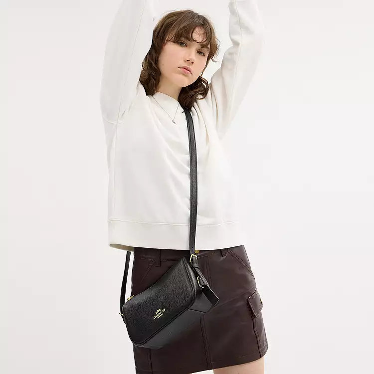 Coach Kailey leather shoulder bag with pebbled black leather and gold accents, featuring a sleek, stylish design.
