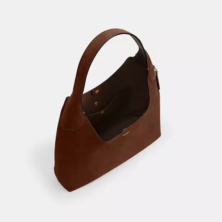 Coach CW636 suede Brooklyn 39 shoulder bag in warm brown with brass hardware, featuring a sleek design and compact silhouette.