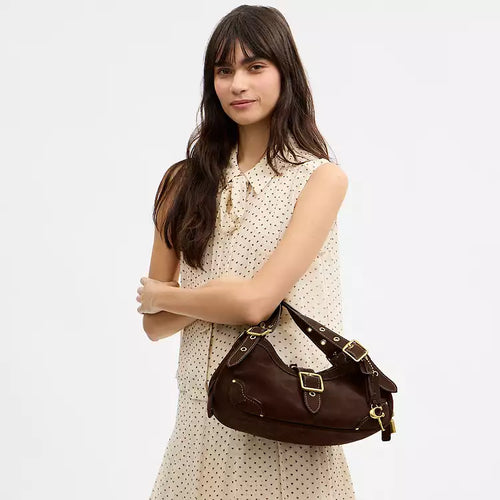 Dark chocolate COACH Drifter Shoulder Bag with refined calf leather and silver-tone hardware, shown on a plain background.