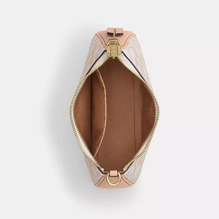 Coach Teri shoulder bag in signature canvas with gold, chalk, and pink accents, featuring a sleek, stylish design.