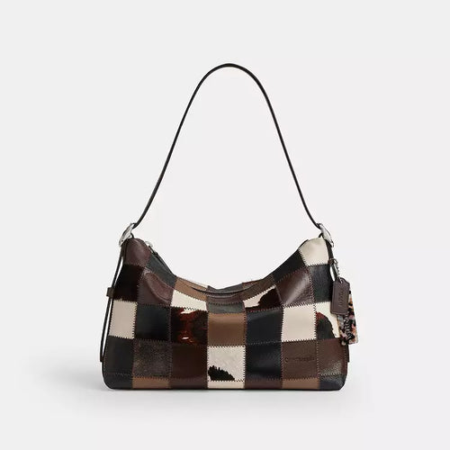 The Tiny Bag Coach Coachtopia Alter/Ego slouchy shoulder bag in maple multi cow print, casual and spacious for everyday use.