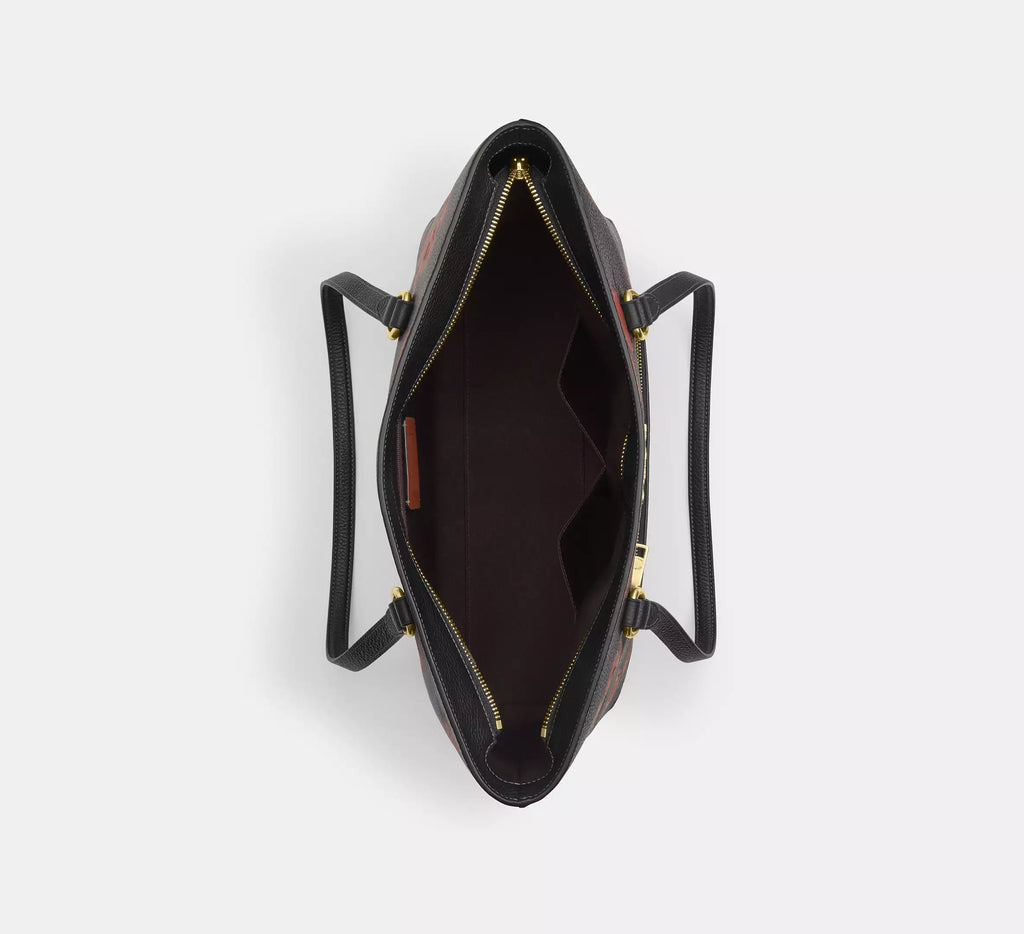 Coach Station Tote Bag with floral print in black and red, featuring the signature design by The Tiny Bag.