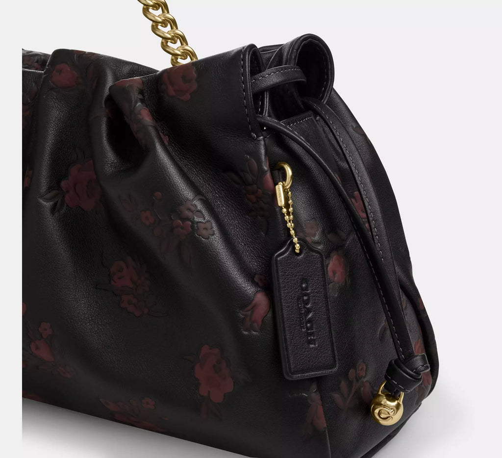 Coach Faye large shoulder bag with floral print leather in black and wine, featuring a spacious design and elegant style.