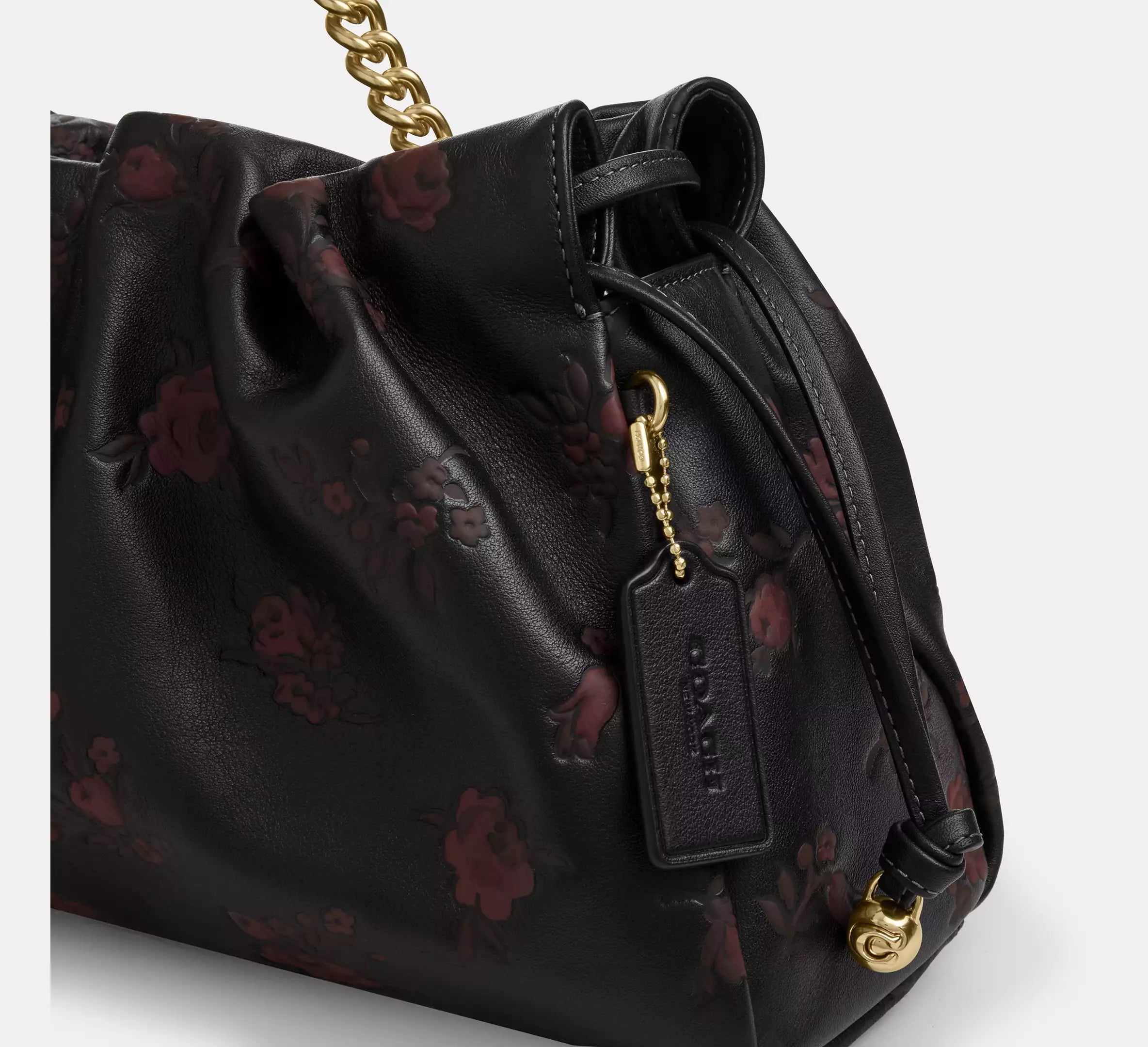 Coach Faye large shoulder bag with floral print leather in black and wine, featuring a spacious design and elegant style.