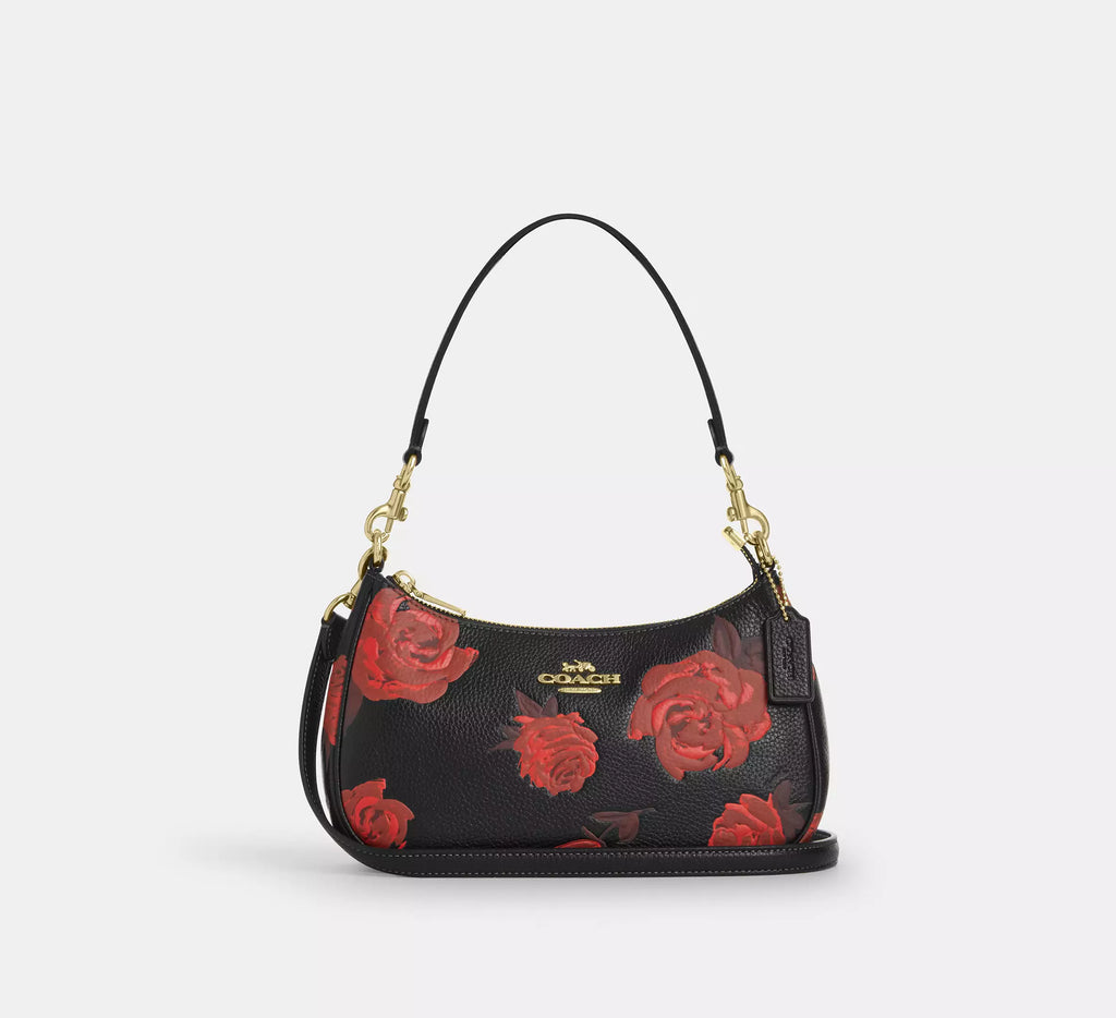 Coach Teri shoulder bag with floral print and leather details, stylish accessory from The Tiny Bag, shown in image cce28_imyem_a0.webp.