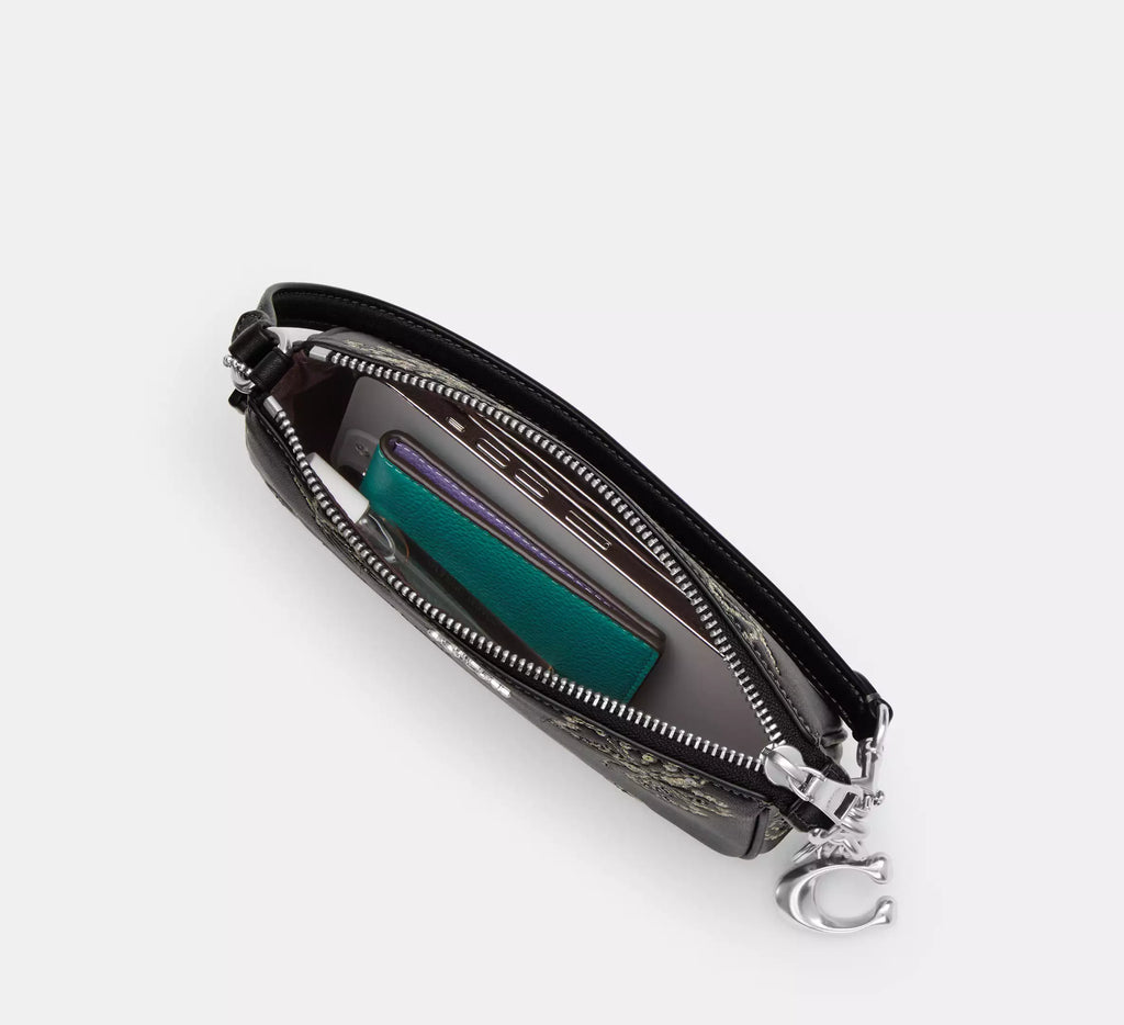 Black leather Coach Nolita 19 shoulder bag with sparkly butterfly print and small size, stylish and versatile accessory.