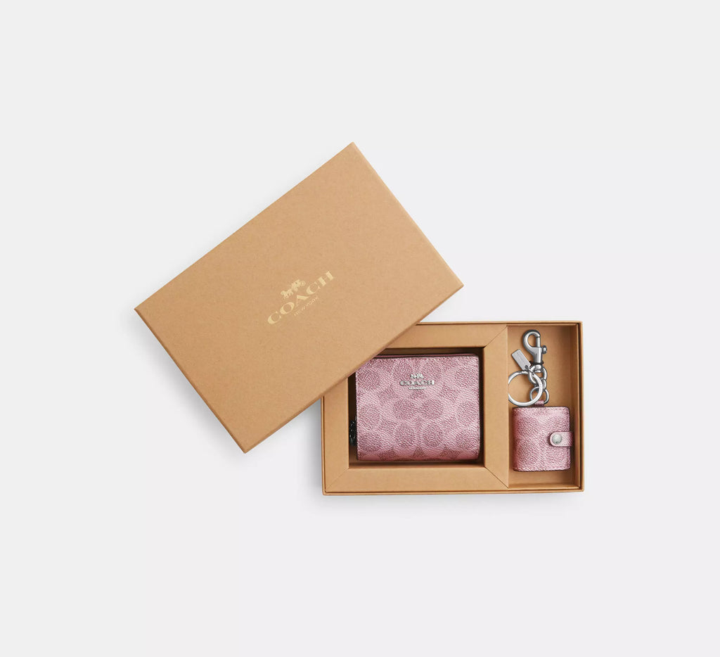 Coach boxed snap wallet with picture frame charm in signature canvas pink and rose, compact wallet with stylish detailing.