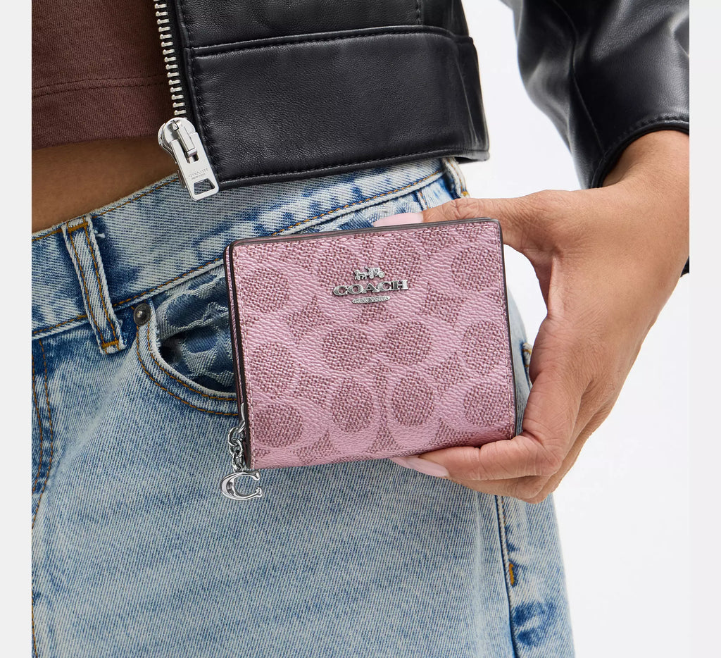 Coach boxed snap wallet with signature canvas in pink and rose, featuring a picture frame charm, by The Tiny Bag.