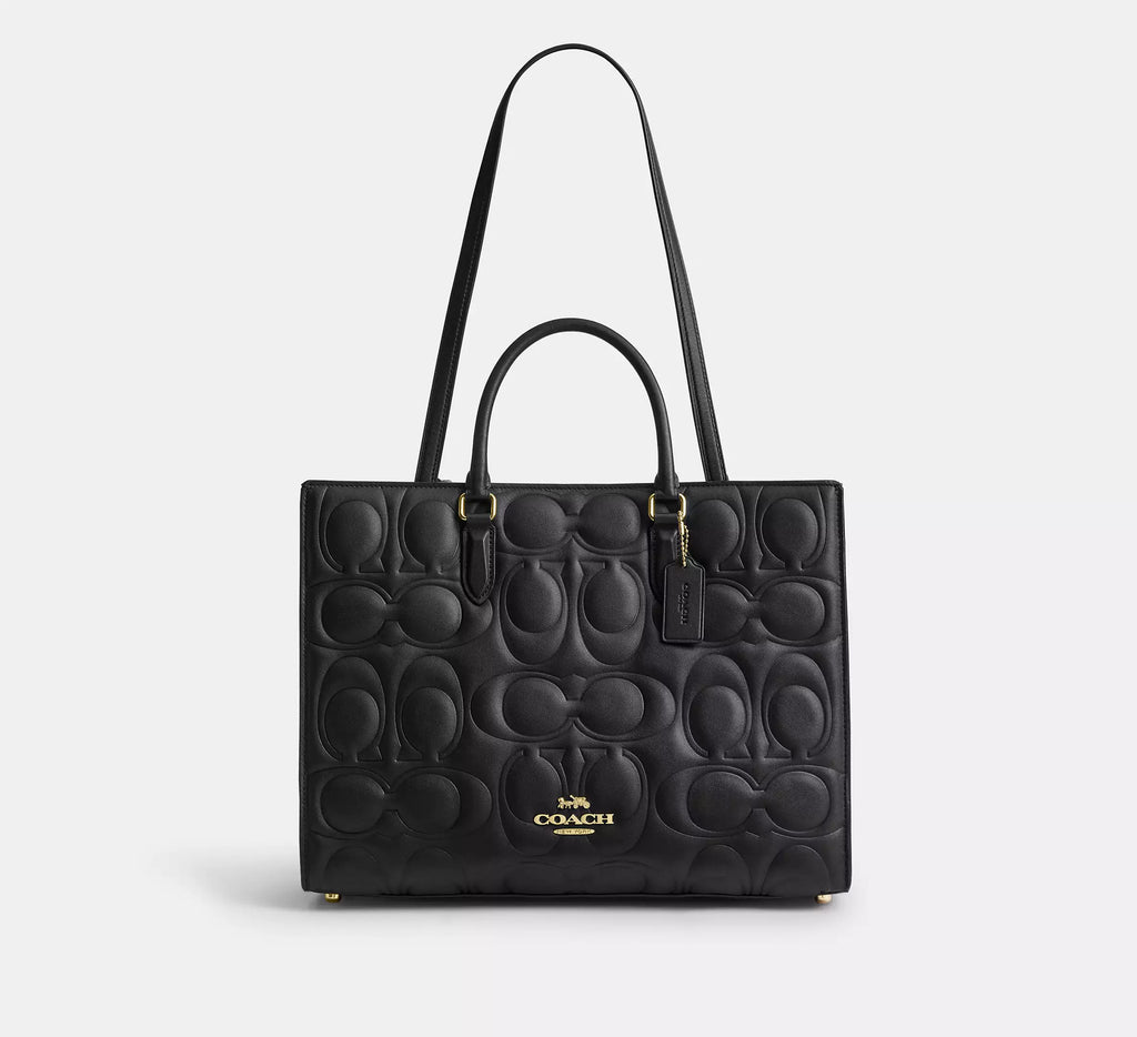 Black Coach Maggie large tote bag in signature leather, featuring sturdy shoulder straps and spacious interior.