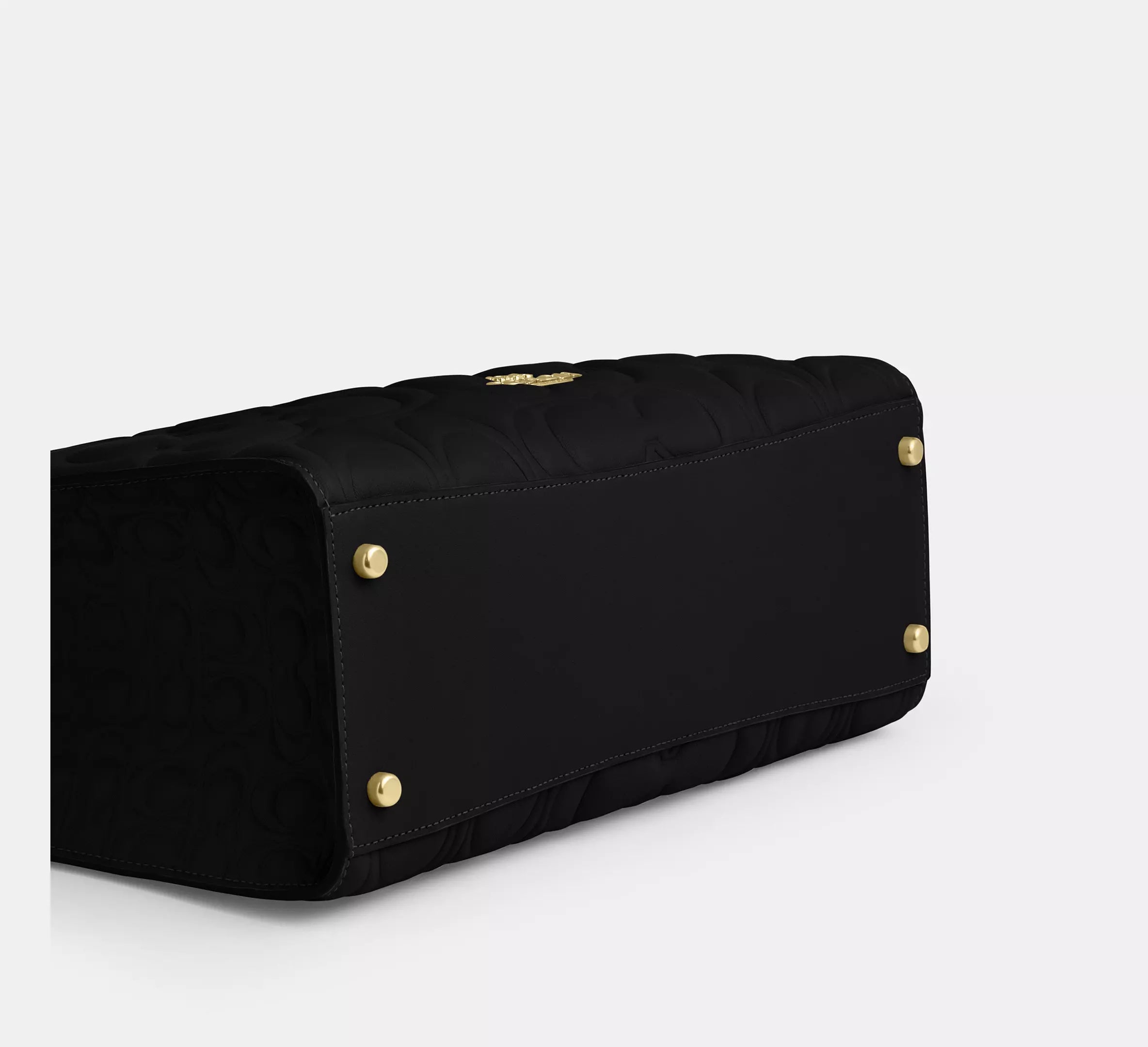 Black Coach Maggie large tote bag in signature leather, featuring shoulder strap and spacious interior for everyday use.