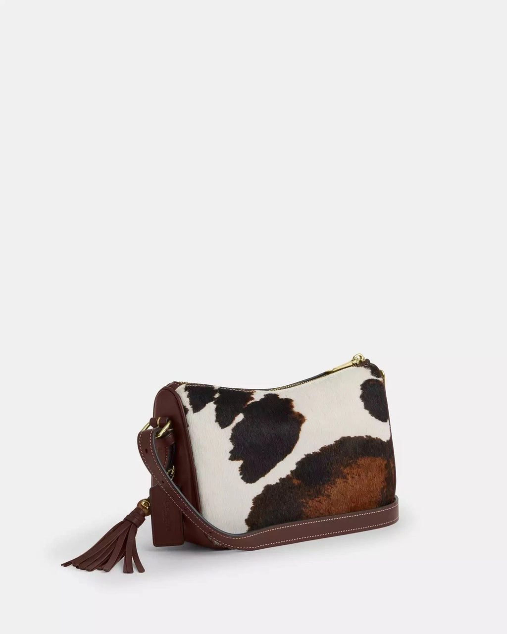 Coach Kailey shoulder bag with cow print, tassel details, brown and white color, featuring the CCC logo, crossbody style.