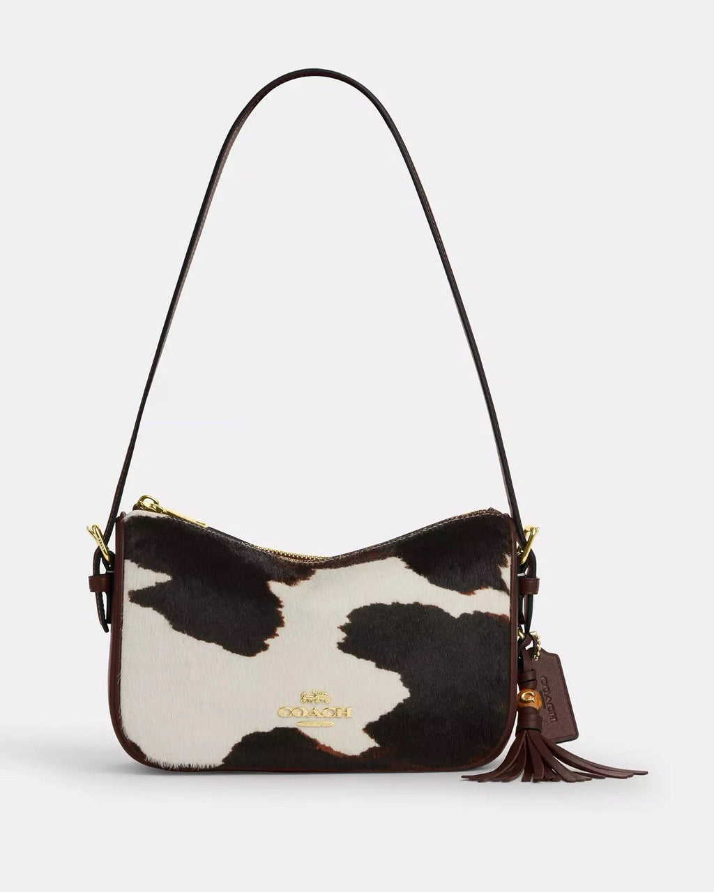 Coach Kailey crossbody shoulder bag with cow print, tassel detail, brown and white color, featuring the CCC84 logo.